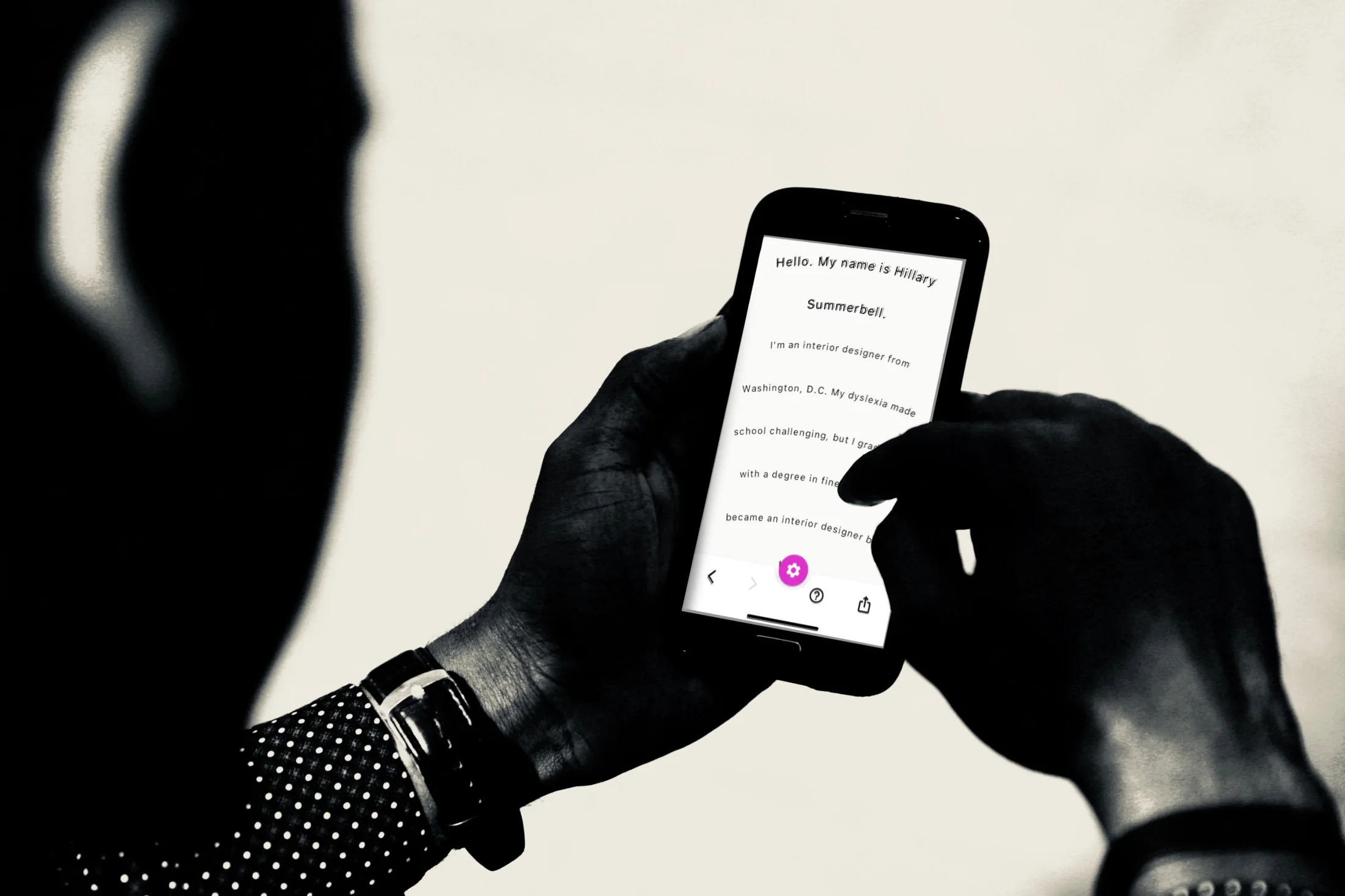 Hands holding a phone running Summerbell